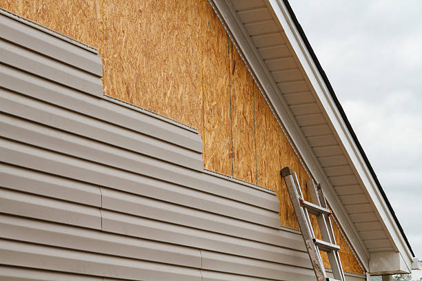 Professional Storm Damage Siding Repair technician working in Bowling Green, VA